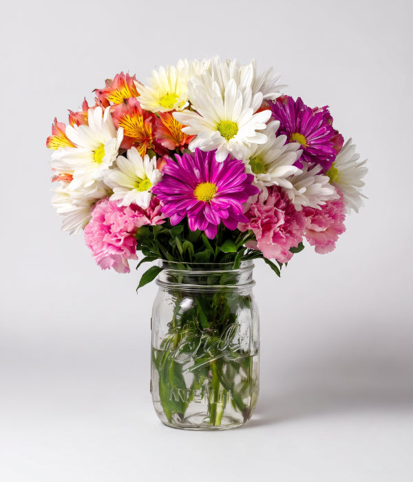 Arrangement floral romantique en bocal Mason